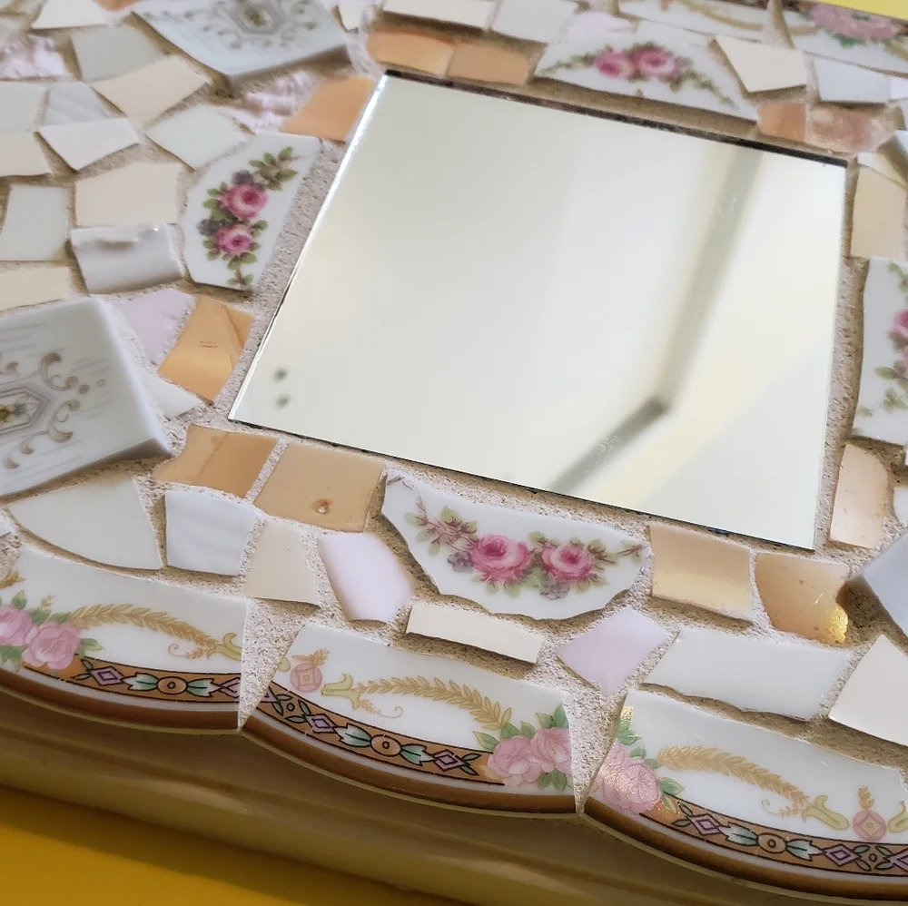 Genuine pique assiette mirror
